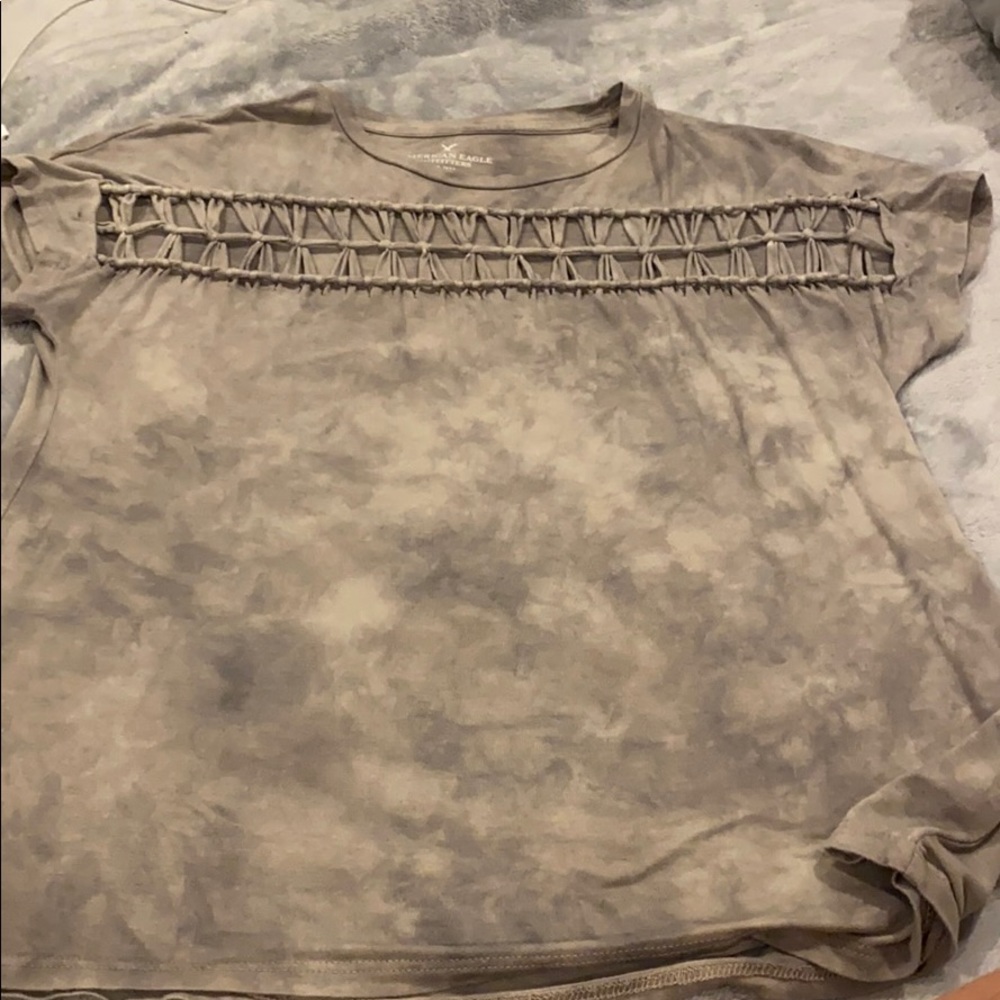 gray tie dye top with design in front